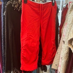 Extra small Nike Capri wind pants that are adjustable waist and cuff